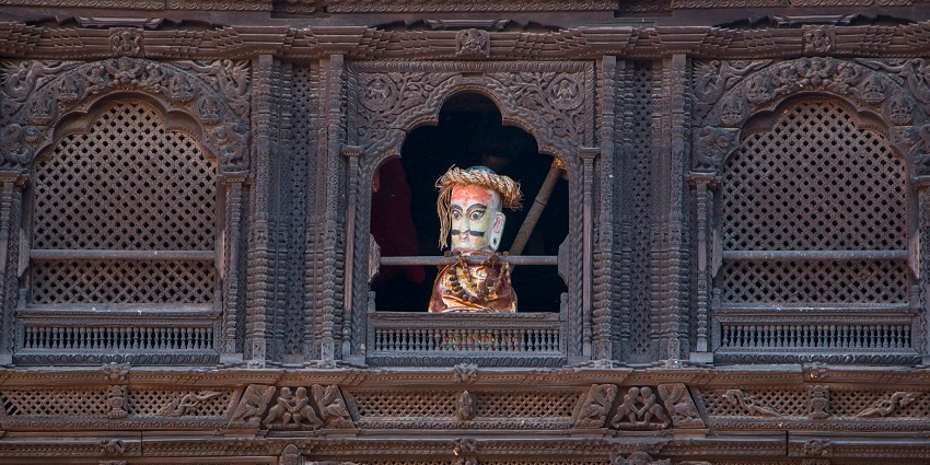 Dattatreya Temple at Bhaktapur and its window sculptures with god watching through the window.