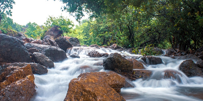Image showcasing the water cascading down through the rocks creating a water current.