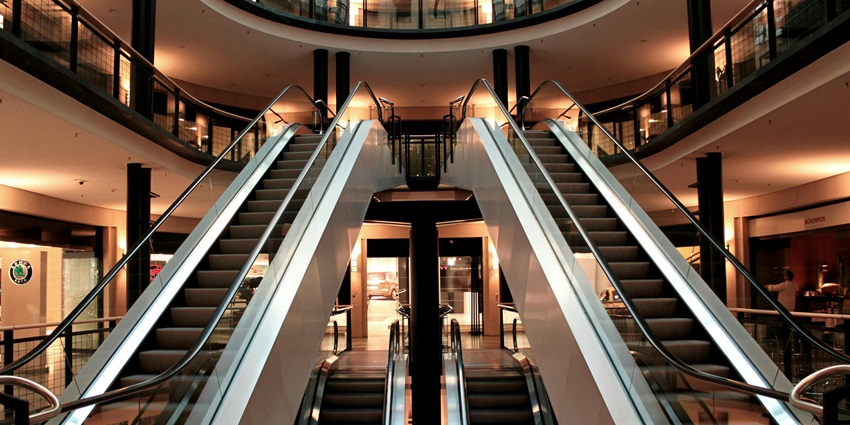 Image of a shopping mall escalator and stunning interior designed for public