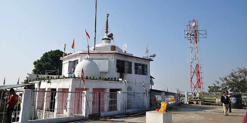 Staircase inside the Pahari Mandir with people entering and exiting the temple.