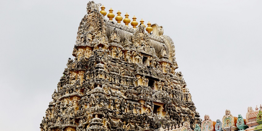 An image of a famous temple surrounded by greenery, a tourist attraction near Thalaiyar Waterfalls.