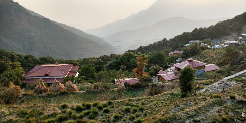 An image of the quaint hamlet of Pangot in Uttarakhand, nestled amid lush green hills.