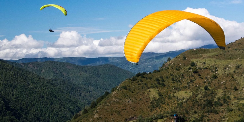 Paragliding with breathtaking views of the lake.