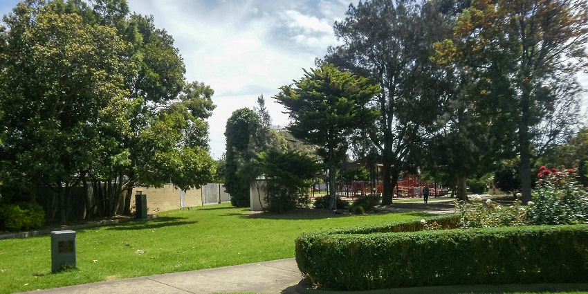 People enjoying a picnic space surrounded by greenery.