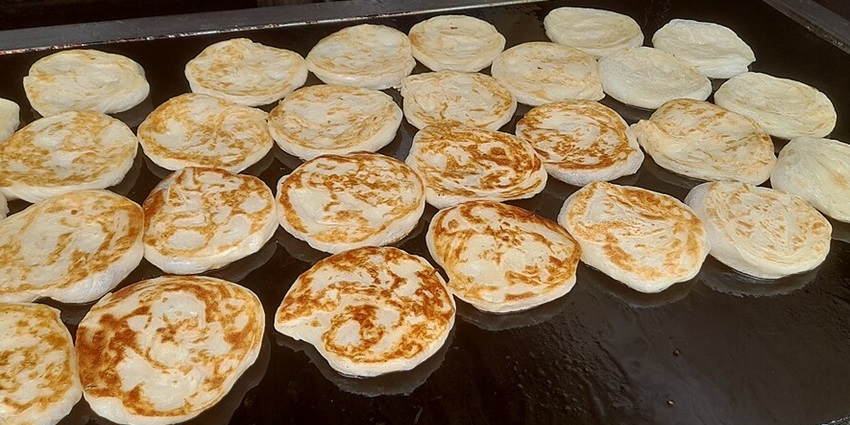 The best food in Kanyakumari is Parotta, flaky Indian flatbread, soft and layered.