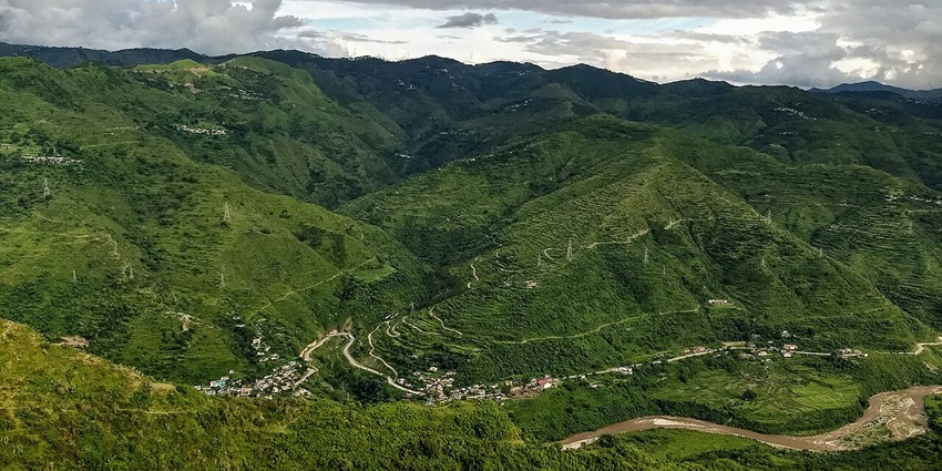 Hilly village landscape near Amotha in Pauri Garhwal with terraced fields and trees