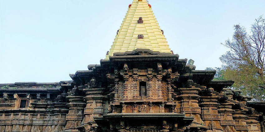 An image of a serene and historical Old temple made of creative work on the rocks.