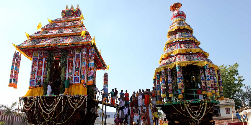 Colourful Perur car festival, vibrant chariot adorned with flowers, pulled by devotees.