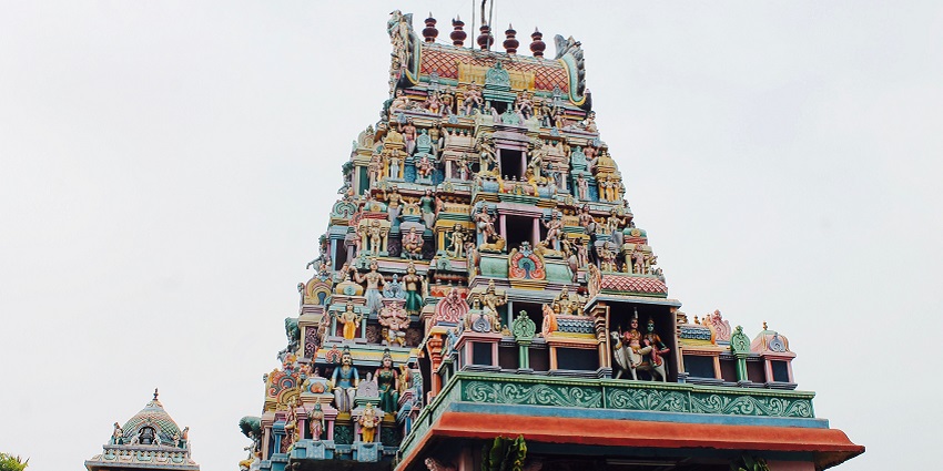 A Tamil Nadu Temple with its ancient stone Dravidian architecture and detailed carvings.