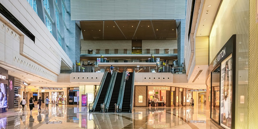An image of a spacious shopping mall, with shoppers in Phoenix United Mall.