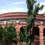 A panoramic view of Madras museum theatre with scenic background.