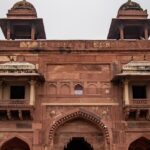 An image of a fort built under the silhouette of Mughal architecture in Fatehpur Sikri.