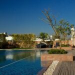 A picture of a poolside area at one of the most expensive hotels in Noida.