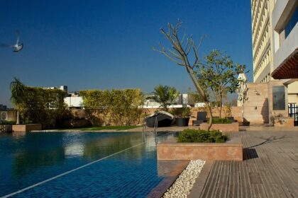 A picture of a poolside area at one of the most expensive hotels in Noida.