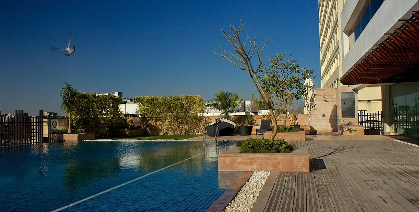 A picture of a poolside area at one of the most expensive hotels in Noida.