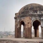 A picture of a dome of a historical mosque in Panipat with views of the city in the background