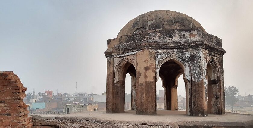 A picture of a dome of a historical mosque in Panipat with views of the city in the background