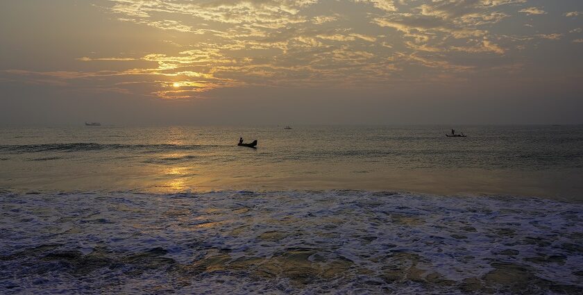 An image showing a scenic view from University Beach in Pondicherry, showcasing calm waves and sand.