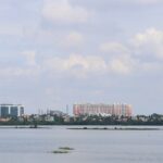 The Chennai skyline from St. Thomas Mount features urban buildings and dense greenery.