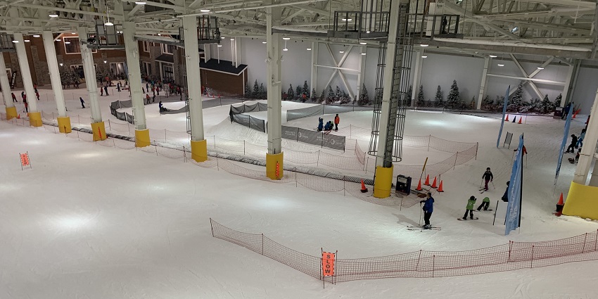 A picture of many people enjoying ice skating and some fun snow activities