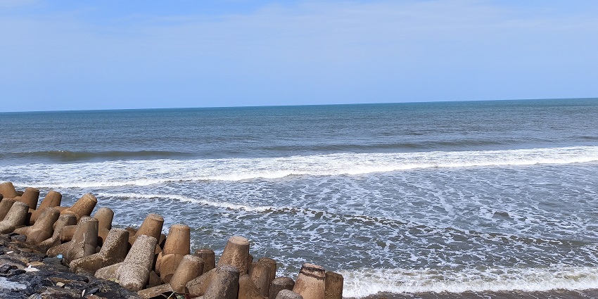A panoramic view of Poompuhar beach and rocky beach with tetrapod structure.