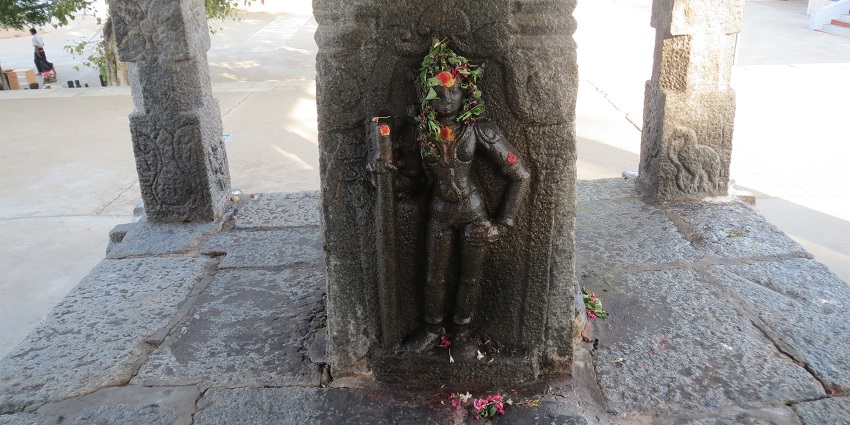 A picture of the Sivanmalai Temple, on a hill, offering a serene environment for devotees.