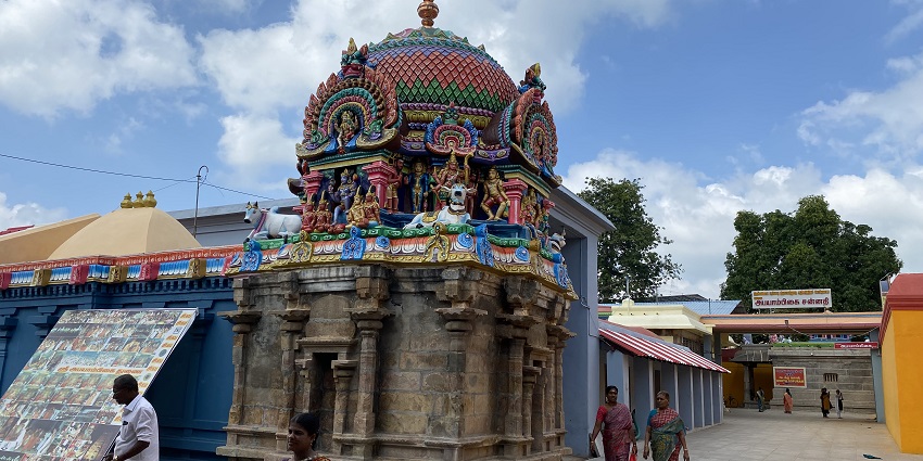 Pilgrims circumambulating the Mayuranathaswami Temple with its colourful carved domes.