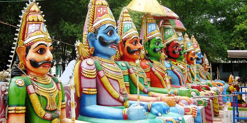 Ayyanar Temple view with colorful statues, traditional gopuram, and vibrant architectural details.