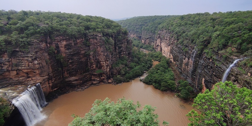 Breathtaking view of Devdari waterfalls from the top of a hill, located near Naugarh Fort
