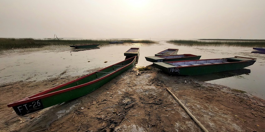 A view of boats on a lake like Ramgarh Lake, a tourist attraction near zoo in Gorakhpur.