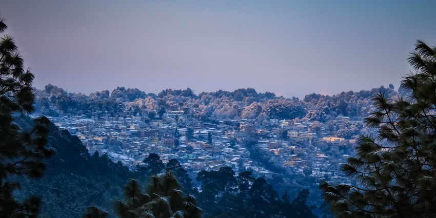 Image of Ranikhet during winter season with misty weather surrounded