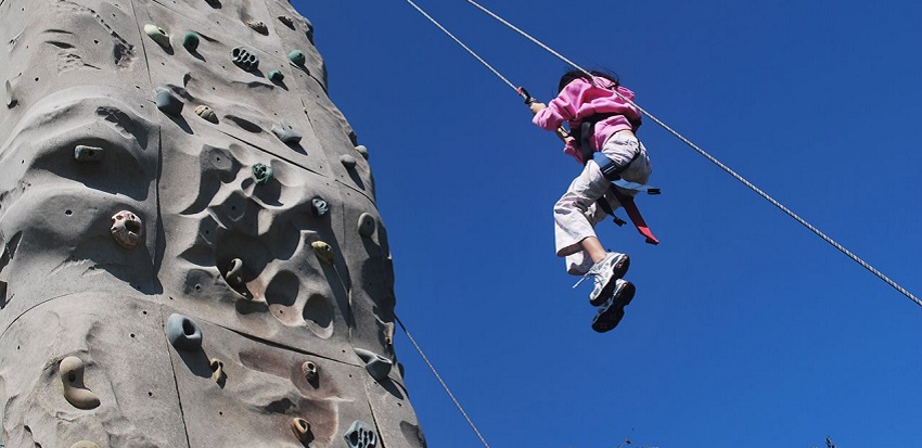 Mussoorie adventure activities using ropes to descend cliffs safely.