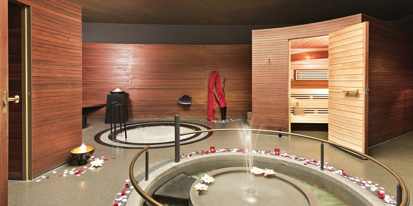 A bed at one of the popular spas, representing the best things to do in Malleswaram.