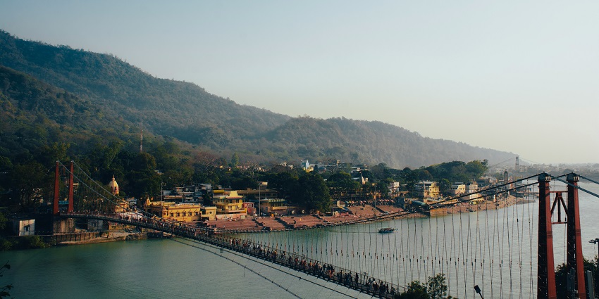 An image showing Rishikesh with its iconic sights, showcasing Ram Jhula and attractions near Dehradun.