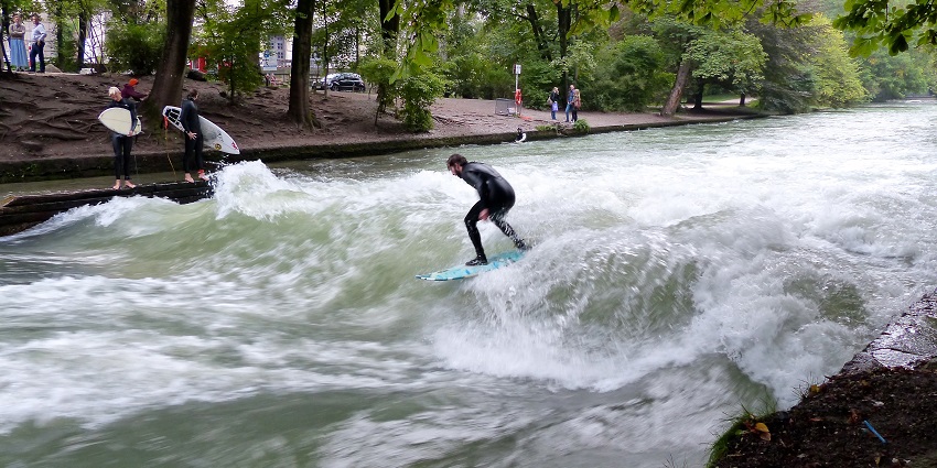 Exciting sports activities like River surfing in the Ganges River in Rishikesh.