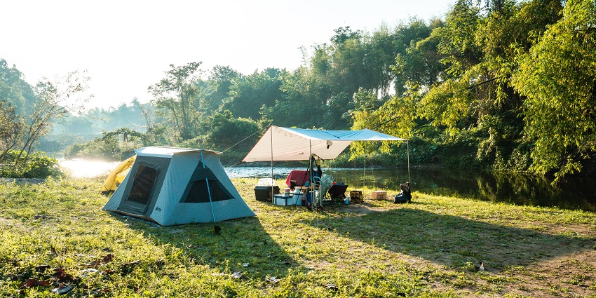 Riverside camping in Mussoorie offers a serene escape for nature lovers near Kempty Falls River.