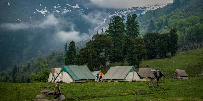 Riverside camping with luxury tents, scenic views, and relaxation.