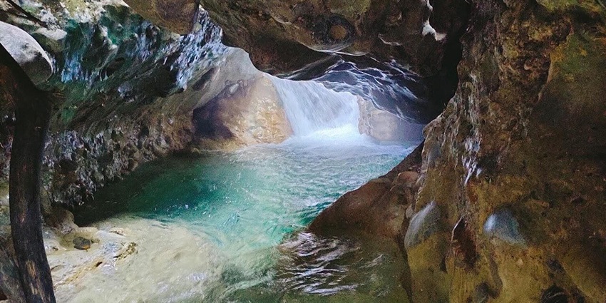 Robber's Cave is a natural scenic cave formation with a river, perfect for exploration.