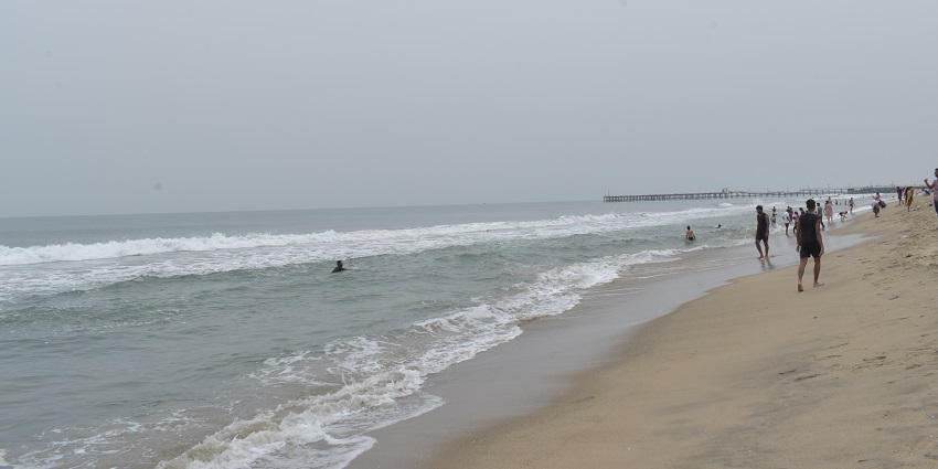 Rock Beach with waves crashing against the rocks, a good place to visit in Pondicherry at night.