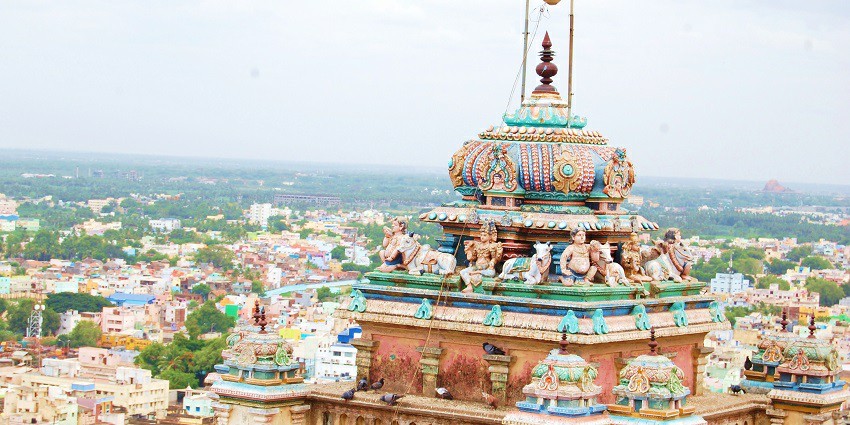 Vibrant Rock Fort Temple on top of a massive rock formation with views of the city below