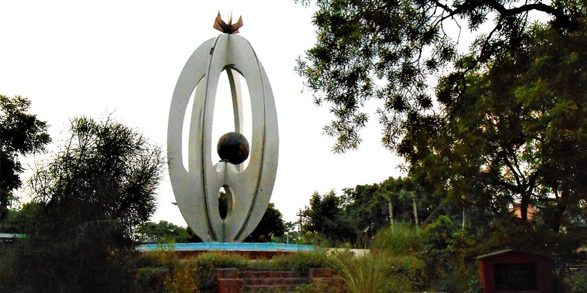 A picture of a sculpture in the middle of a Park in Rudrapur city.
