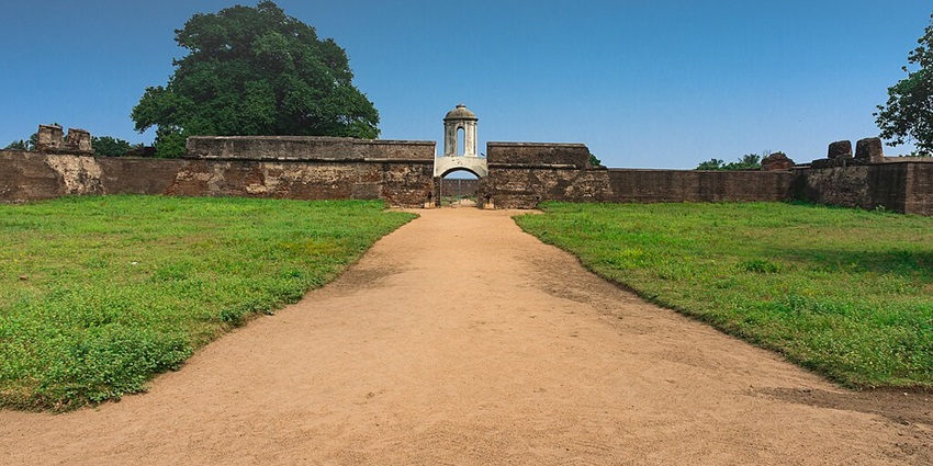 Sadras dutch fort pathway to the entrance with old walls surrounded by green land.