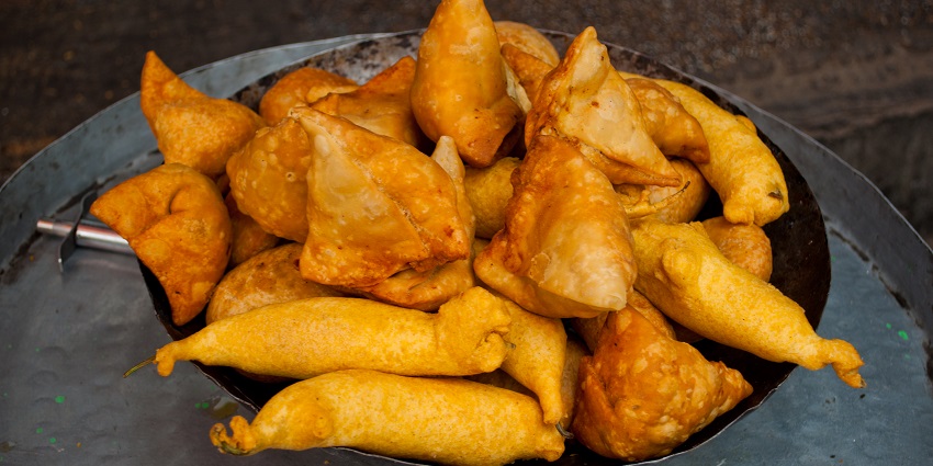 Deep-fried pastry stuffed with spiced potatoes and peas.