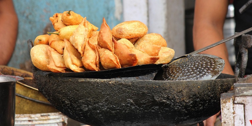 Crispy triangular pastries filled with spiced potatoes and peas.