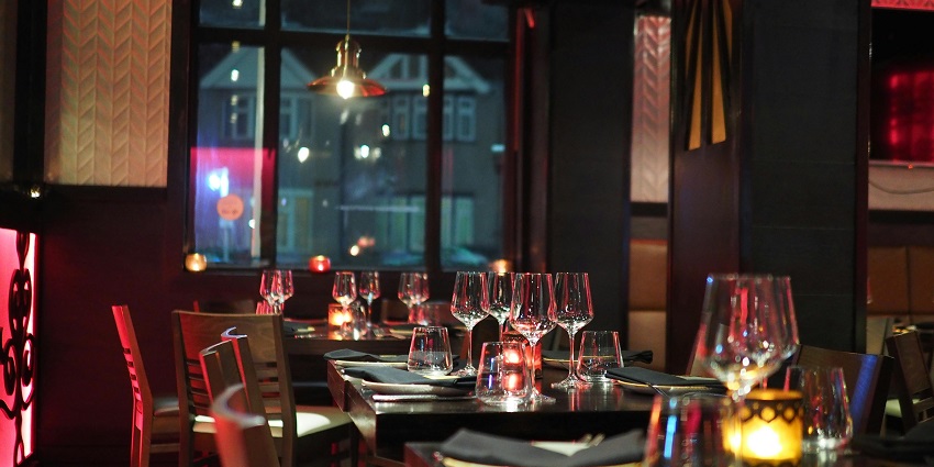 An image showcasing Sangam Hotels' lively dinner table during exciting Trichy New Year parties.