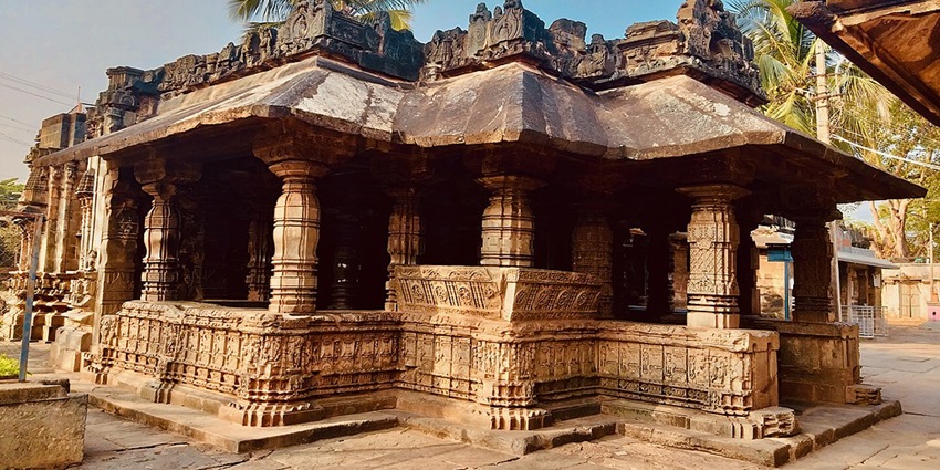 Stone temple structure of Saraswati featuring intricate carvings