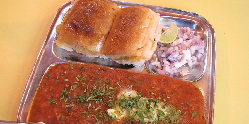 Pav Bhaji served with dollops of butter and chopped onions in Sardaar Pav Bhaji, Mumbai
