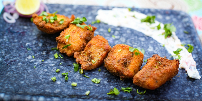A top view of several crispy and flavourful masala fries - a famous street food in Thane.