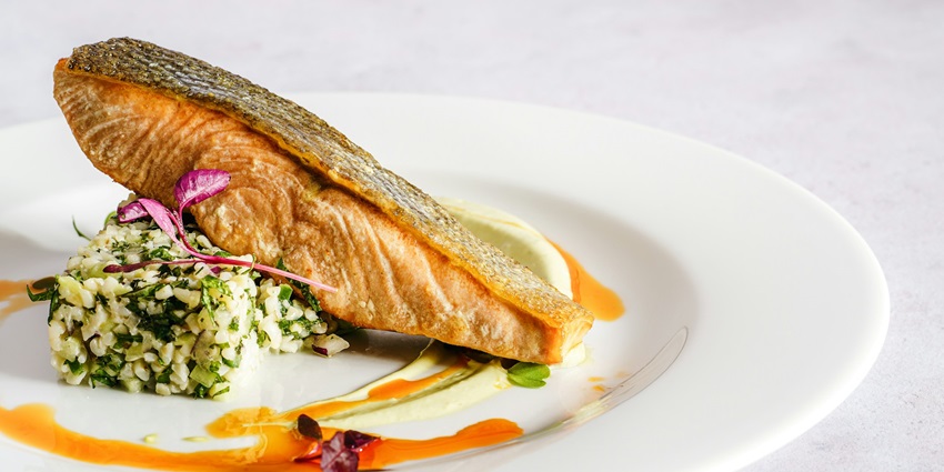 Fresh catch prepared in various styles, flavourful and delicious on a white ceramic plate.