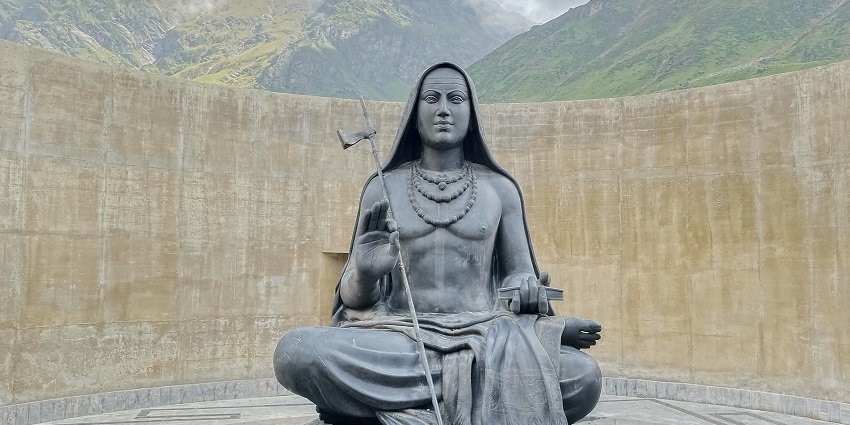 Image of historical site commemorating Adi Shankaracharya Samadhi under clear blue sky